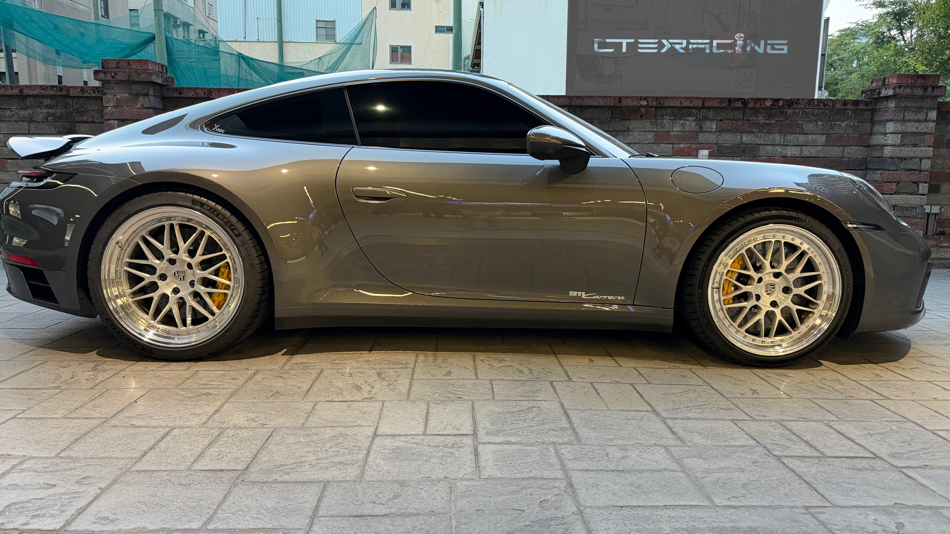 Porsche 911 (992) Carrera T with the CTE RACING Classic Yellow carbon ceramic brake kit installed